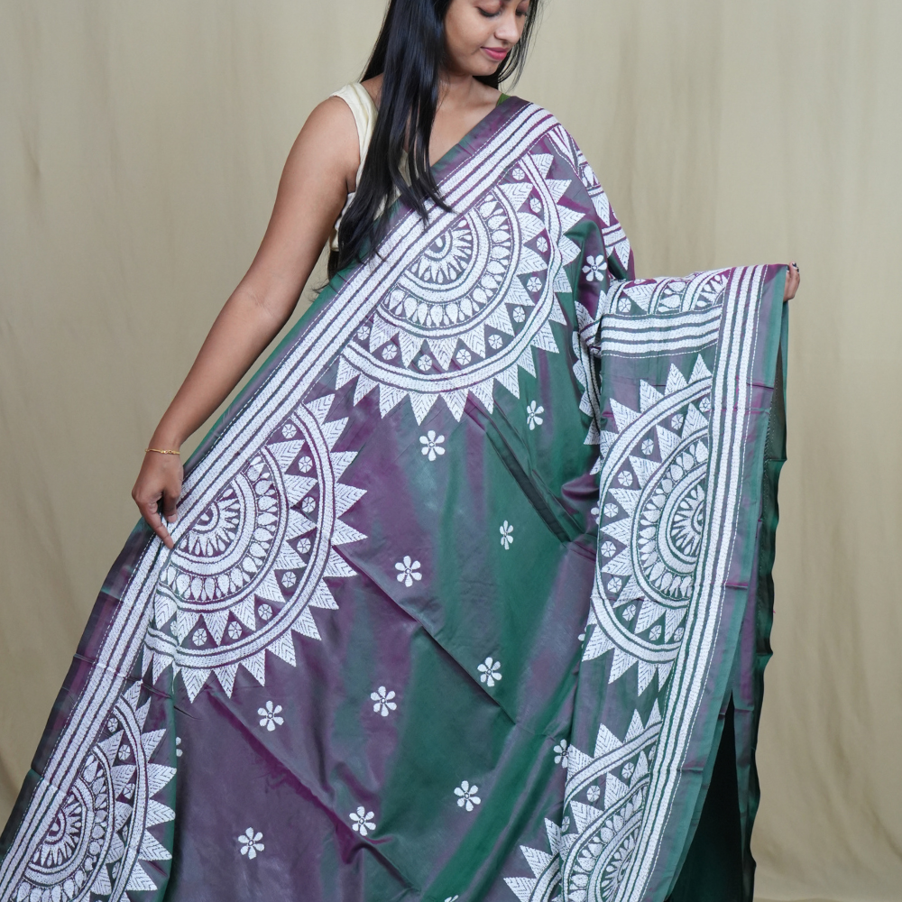 Elegant silk saree featuring Kantha work borders and detailed Kantha pallu design.
