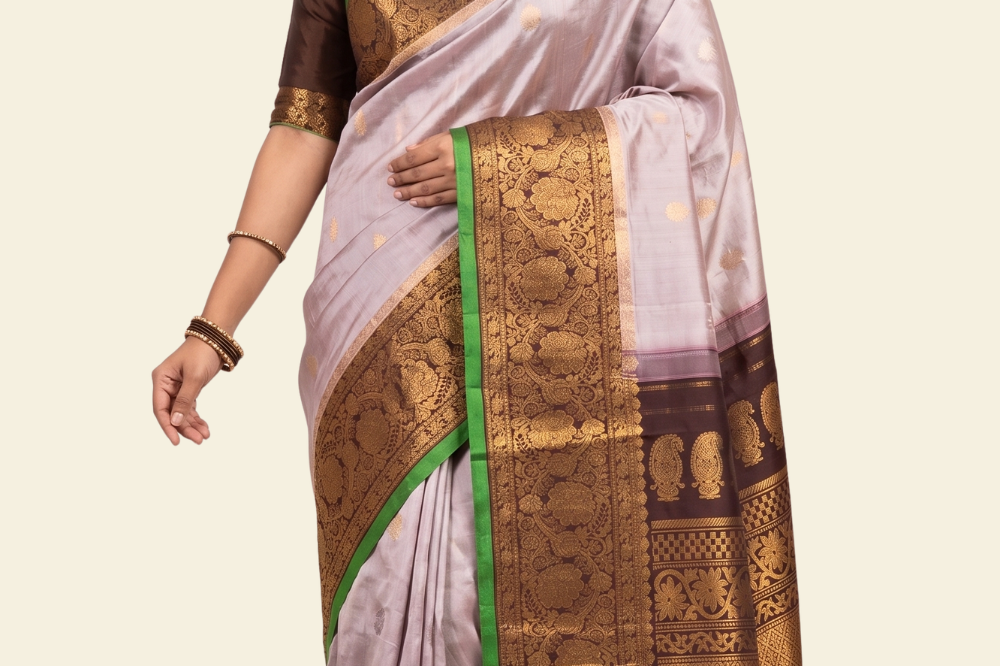 Pure handloom Gadwal silk saree with all-over zari motifs and intricate turning borders
