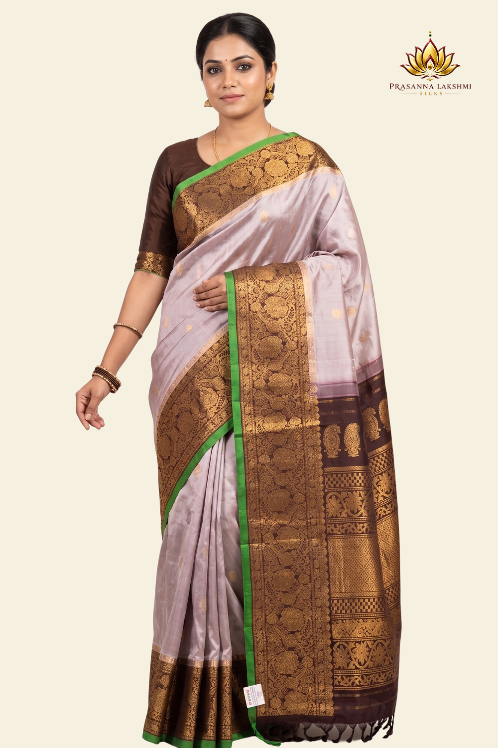 Pure handloom Gadwal silk saree with all-over zari motifs and intricate turning borders

