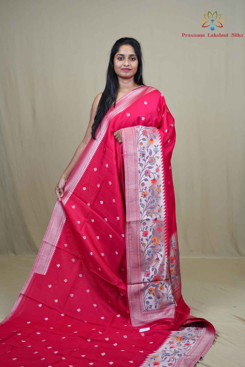 Tussar Georgette Saree with all-over silver zari woven motifs and floral Meenakari borders.
