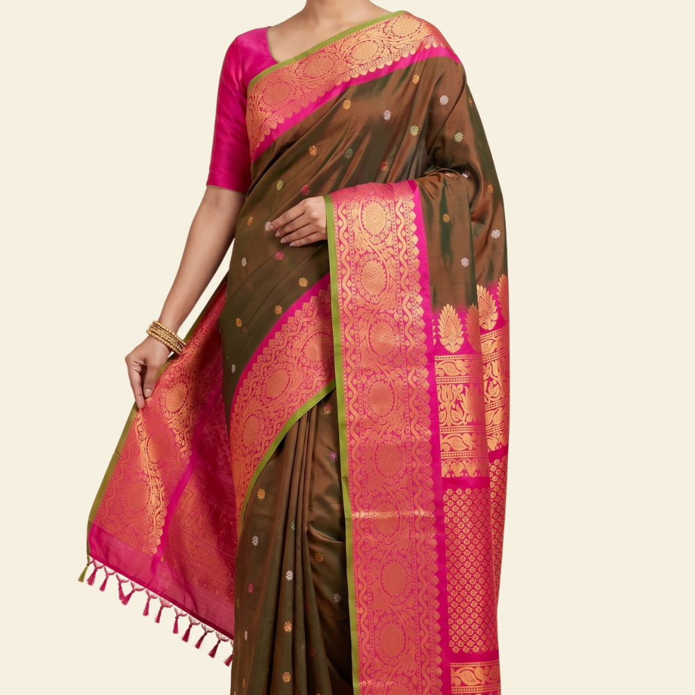 Pure handloom Gadwal silk saree with all-over zari motifs and intricate turning borders
