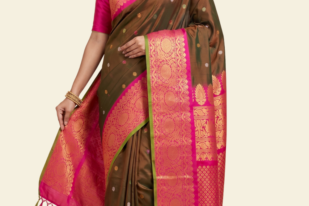 Pure handloom Gadwal silk saree with all-over zari motifs and intricate turning borders

