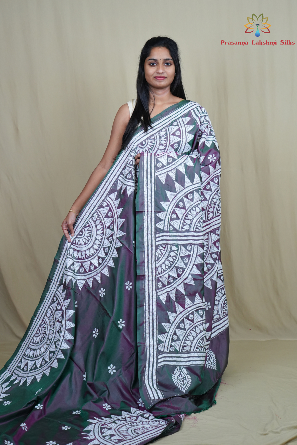 Semi Bangalore silk saree with all-over hand Kantha work and rich embroidered pallu.
