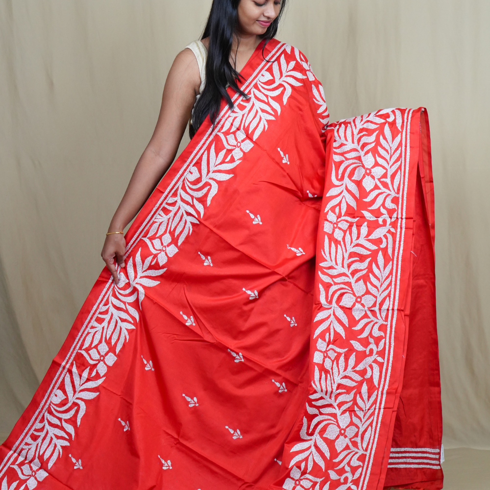 Elegant silk saree featuring Kantha work borders and detailed Kantha pallu design.
