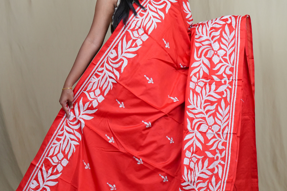 Elegant silk saree featuring Kantha work borders and detailed Kantha pallu design.
