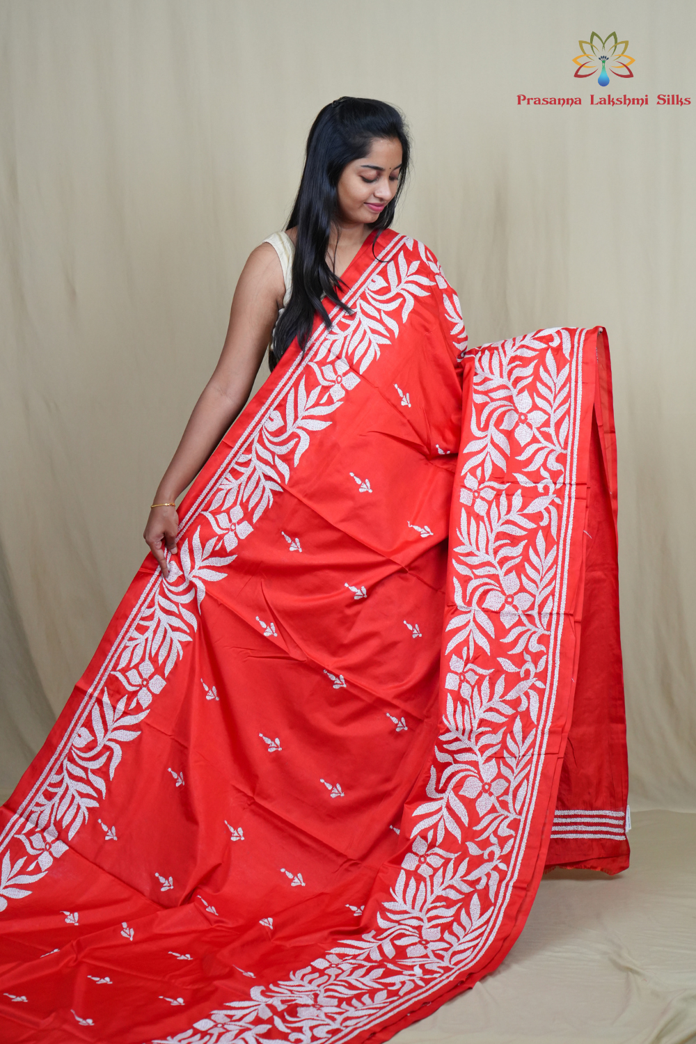 Elegant silk saree featuring Kantha work borders and detailed Kantha pallu design.
