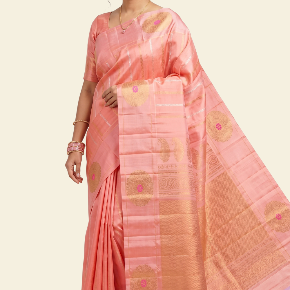 Pure handloom Gadwal silk saree with all-over zari motifs and intricate turning borders
