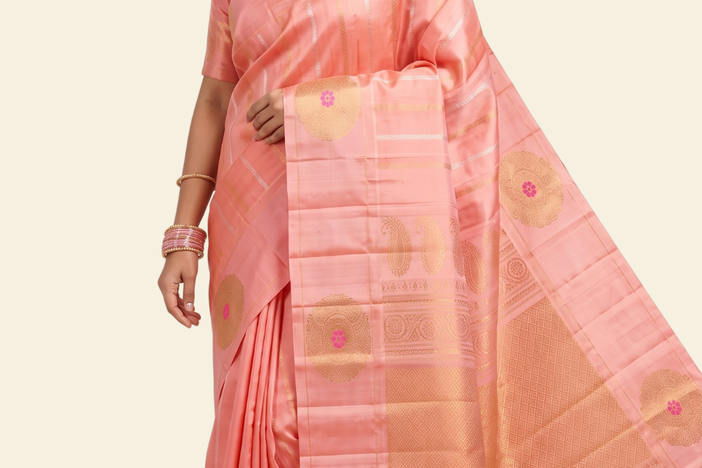 Pure handloom Gadwal silk saree with all-over zari motifs and intricate turning borders

