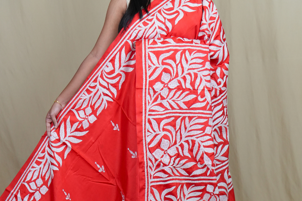 Semi Bangalore silk saree with all-over hand Kantha work and rich embroidered pallu.

