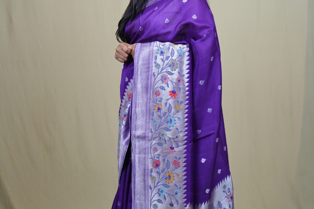Tussar Georgette Saree with all-over silver zari woven motifs and floral Meenakari borders.

