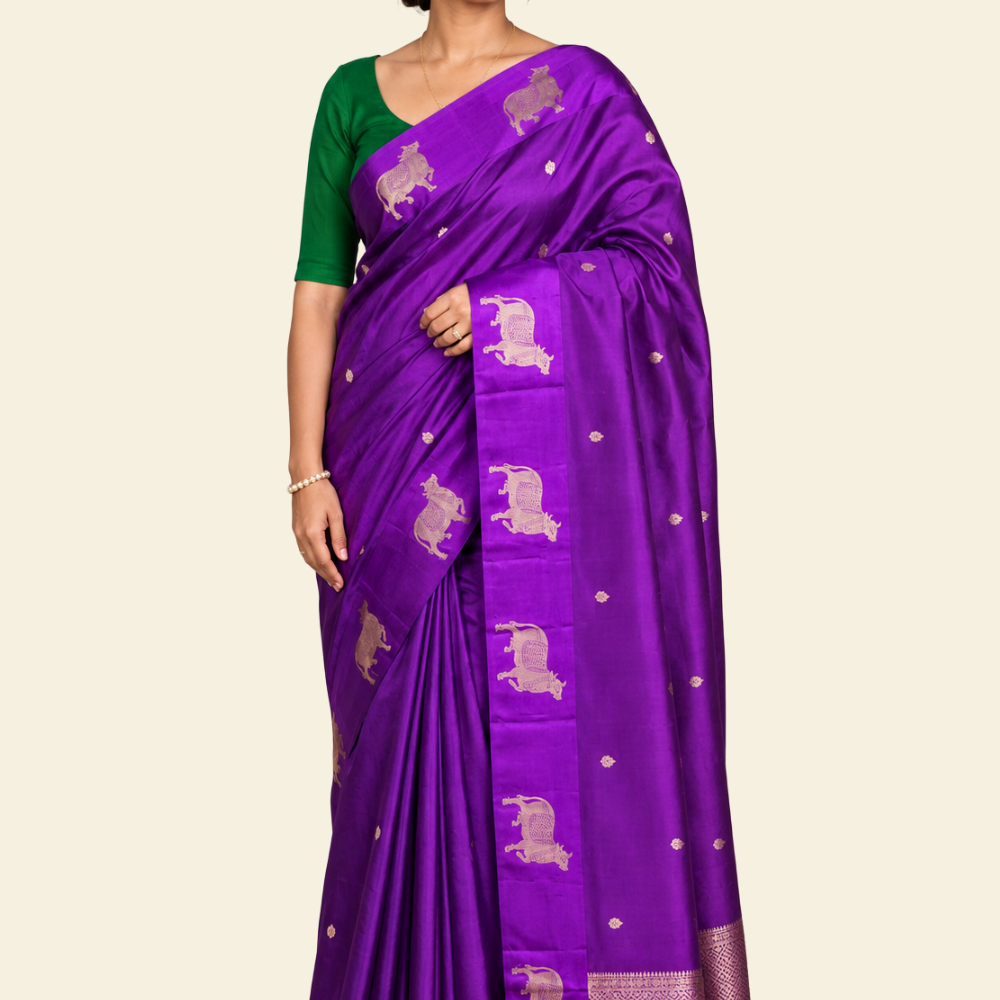 Pure Banarasi Raw Mango Silk saree with allover zari motifs and cow motif border
