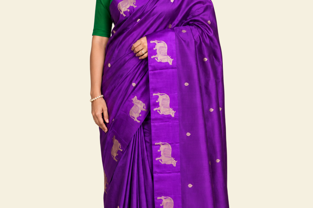 Pure Banarasi Raw Mango Silk saree with allover zari motifs and cow motif border
