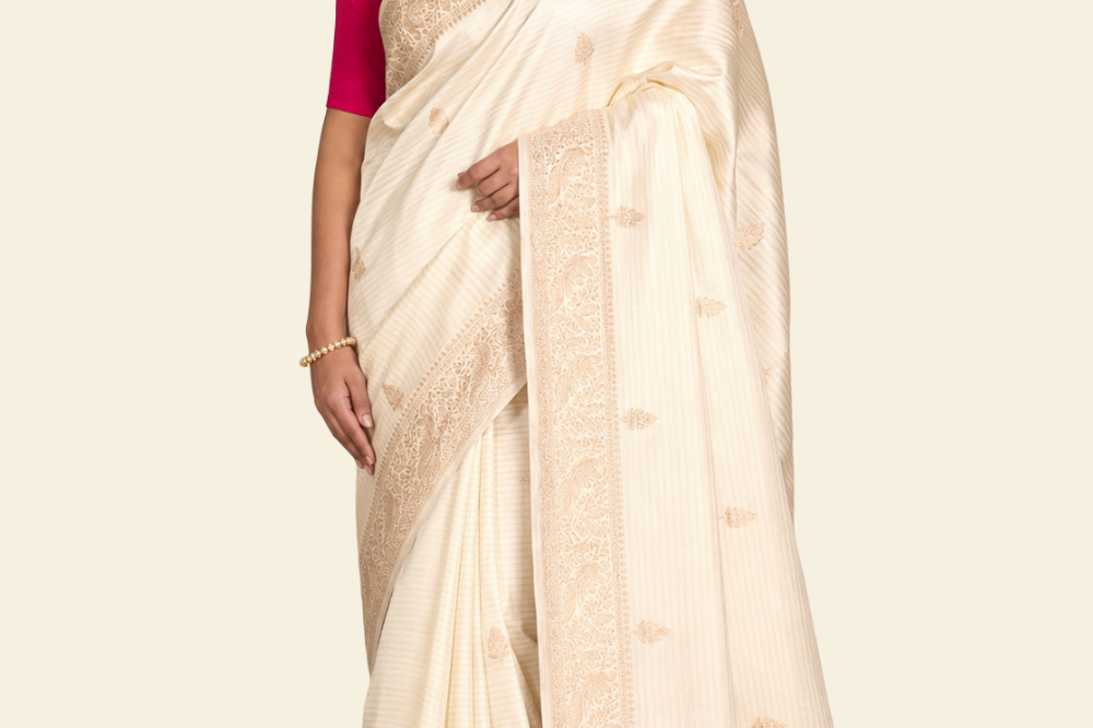 Pure Banarasi Raw Mango Silk saree with allover zari motifs and cow motif border
