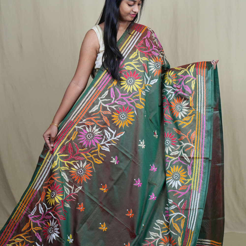 Elegant silk saree featuring Kantha work borders and detailed Kantha pallu design.
