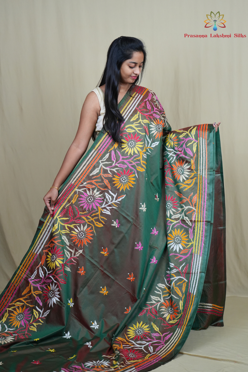 Elegant silk saree featuring Kantha work borders and detailed Kantha pallu design.
