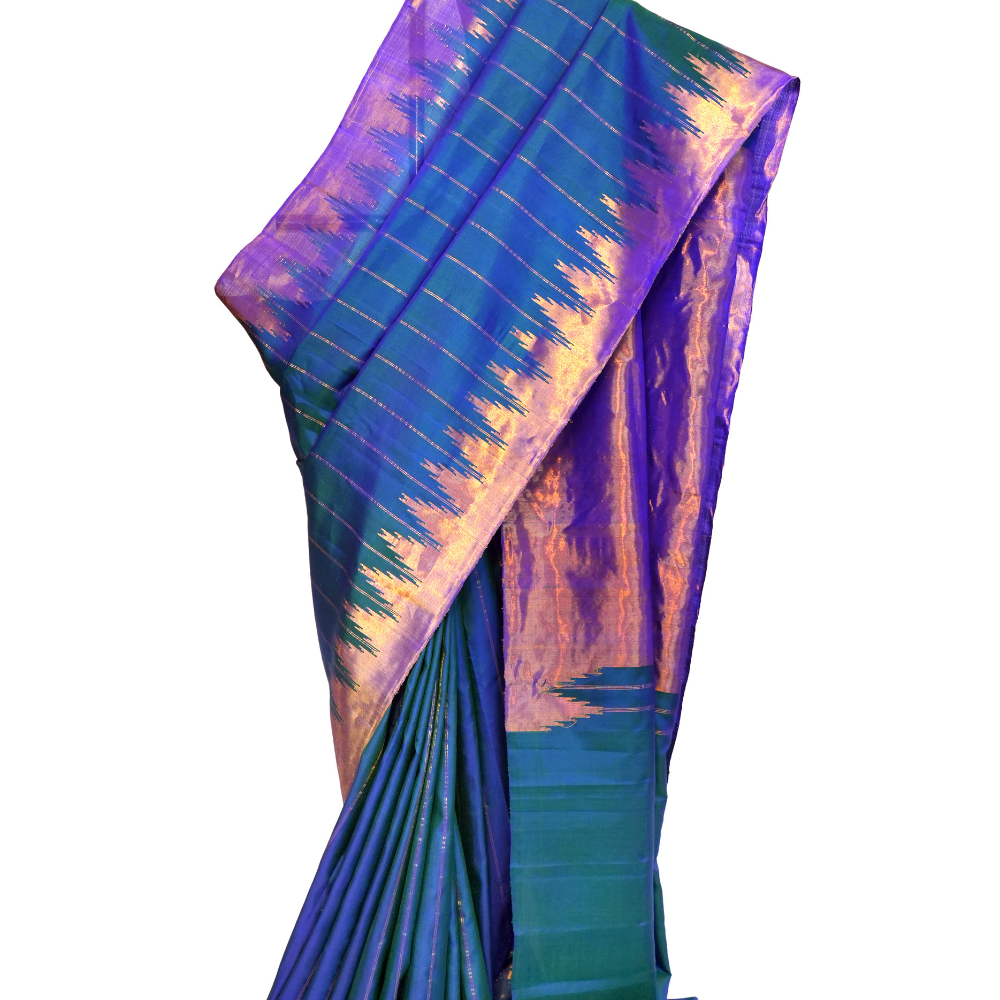 Handloom Gadwal pure silk saree with all-over zari stripes and rich tissue pallu.

