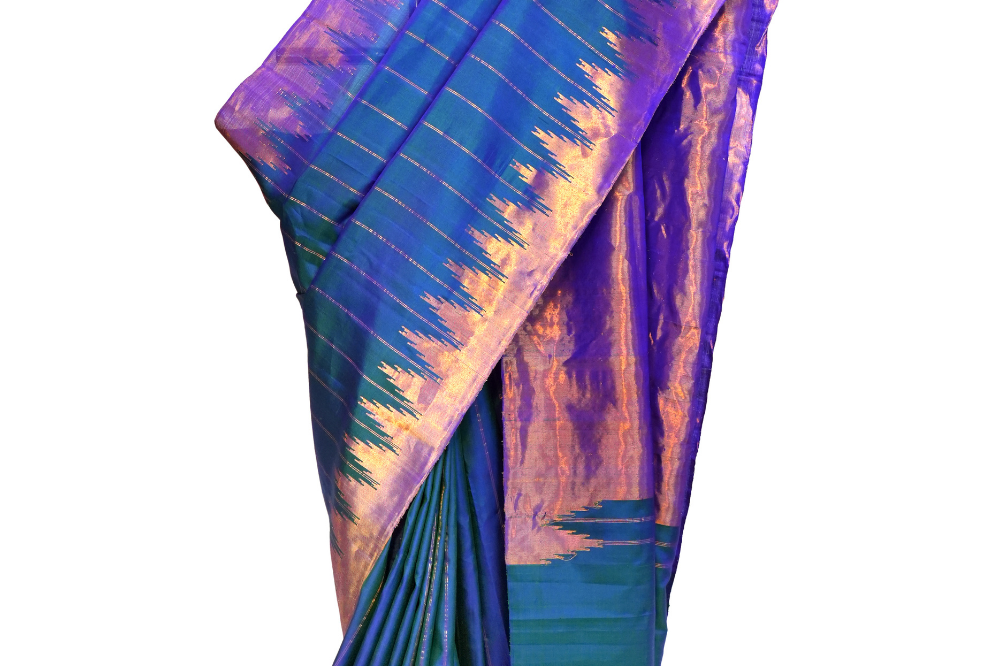 Handloom Gadwal pure silk saree with all-over zari stripes and rich tissue pallu.
