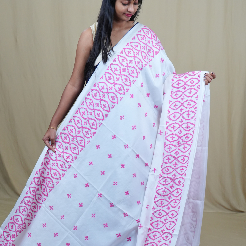 Traditional semi silk saree featuring beautiful hand Kutch work borders and artistic design.
