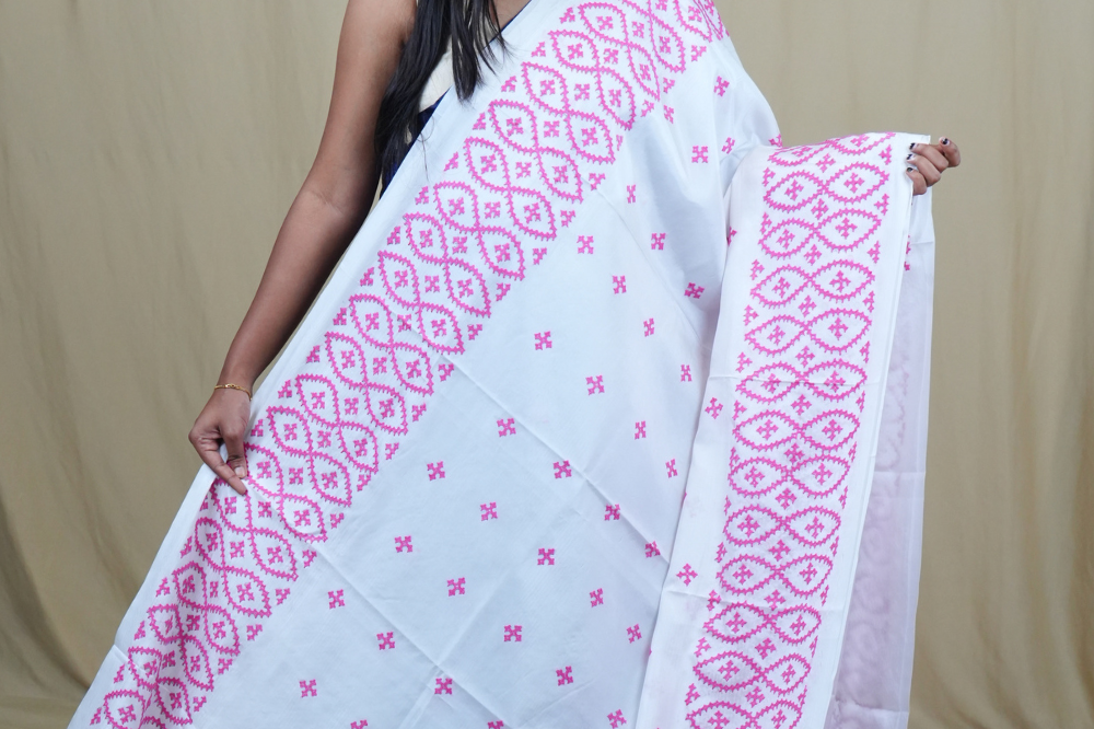 Traditional semi silk saree featuring beautiful hand Kutch work borders and artistic design.
