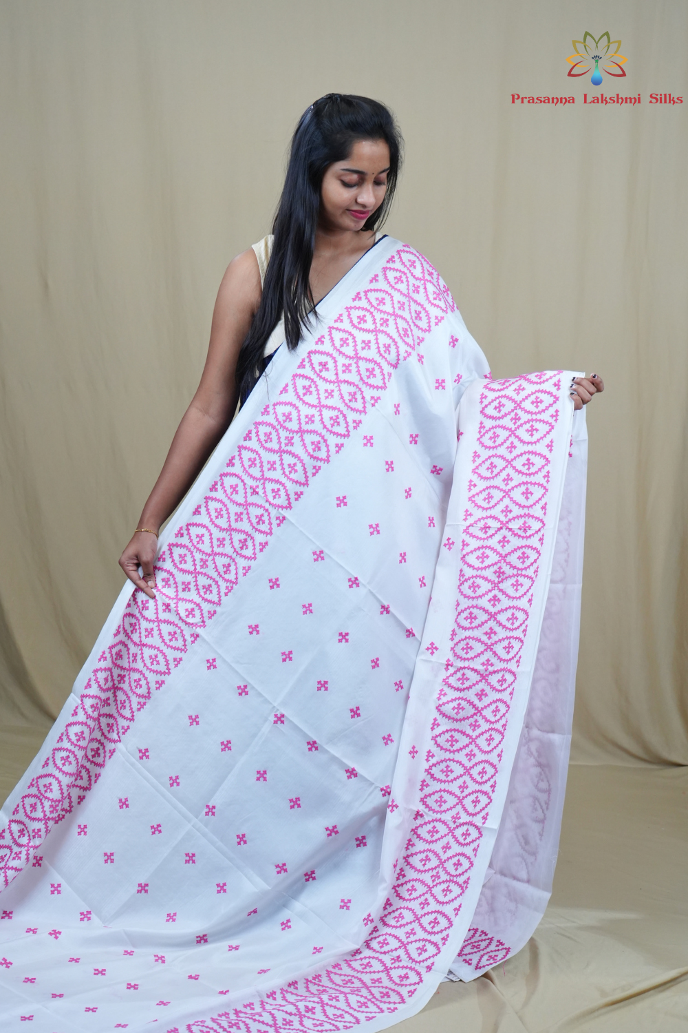 Traditional semi silk saree featuring beautiful hand Kutch work borders and artistic design.
