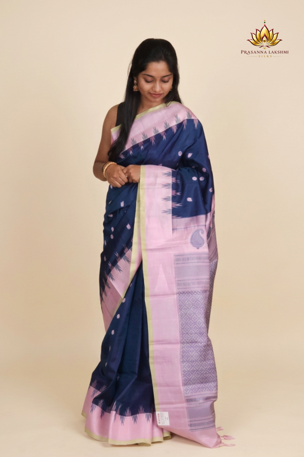 Silk Mark certified peacock blue Gadwal silk saree with pink blouse and intricate zari motifs
