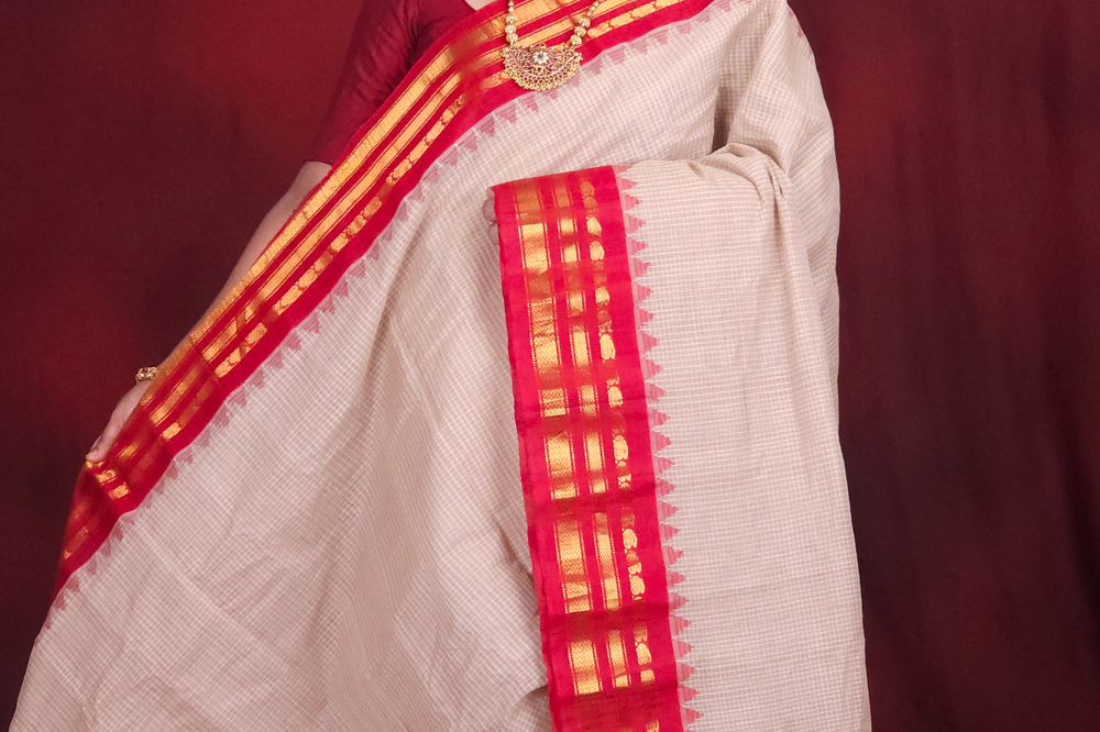 Lightweight Gadwal cotton saree featuring elegant zari border and striped pallu design.
