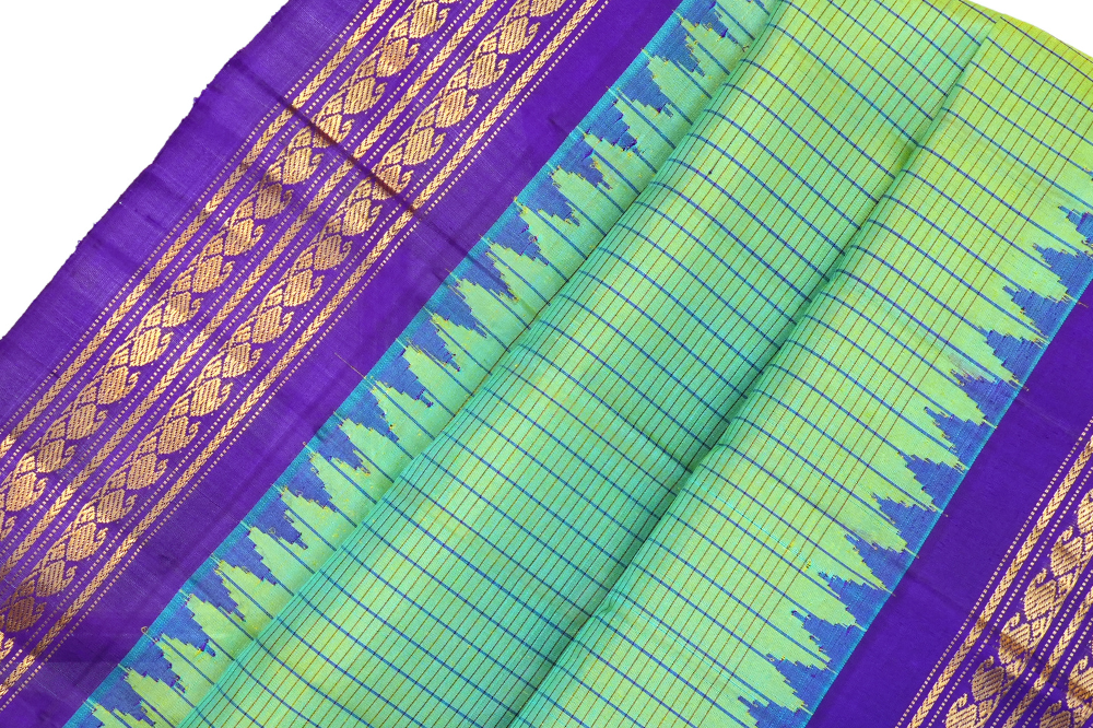 Handloom Gadwal pure silk saree with all-over zari stripes and rich tissue pallu.
