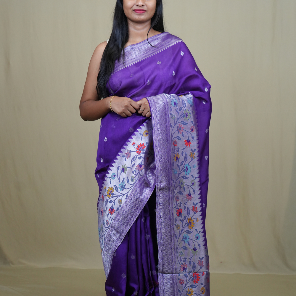 Tussar Georgette Saree with all-over silver zari woven motifs and floral Meenakari borders.
