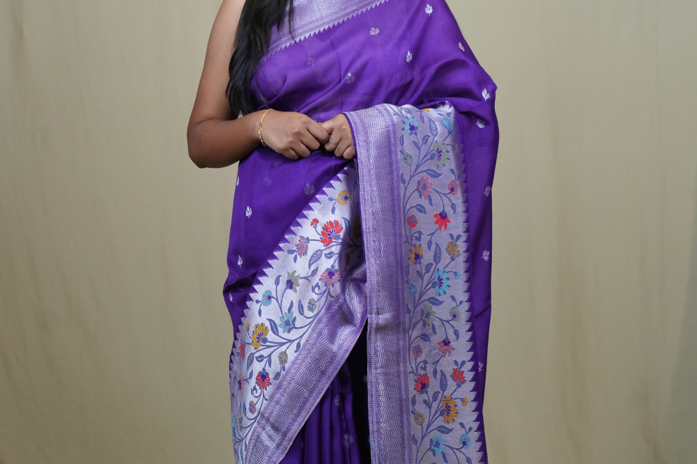 Tussar Georgette Saree with all-over silver zari woven motifs and floral Meenakari borders.
