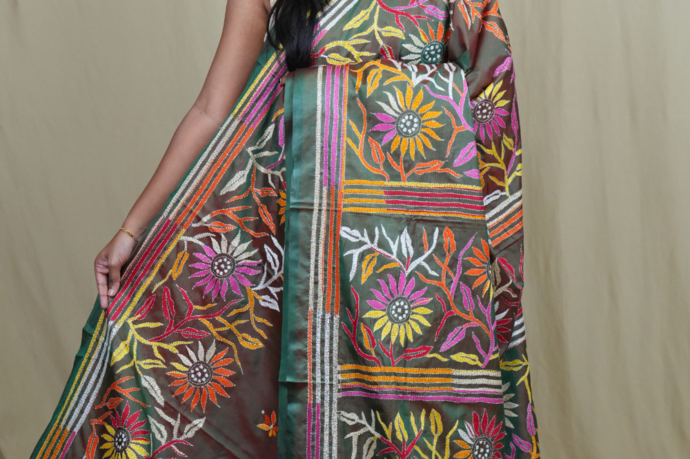 Semi Bangalore silk saree with all-over hand Kantha work and rich embroidered pallu.