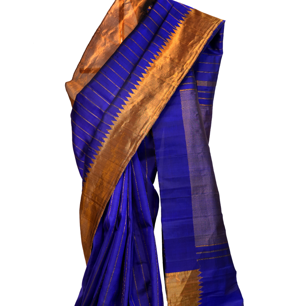 Handloom Gadwal pure silk saree with all-over zari stripes and rich tissue pallu.
