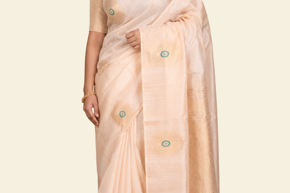 Pure handloom Gadwal silk saree with all-over zari motifs and intricate turning borders
