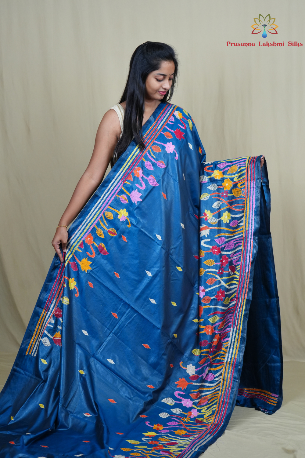 Elegant silk saree featuring Kantha work borders and detailed Kantha pallu design.
