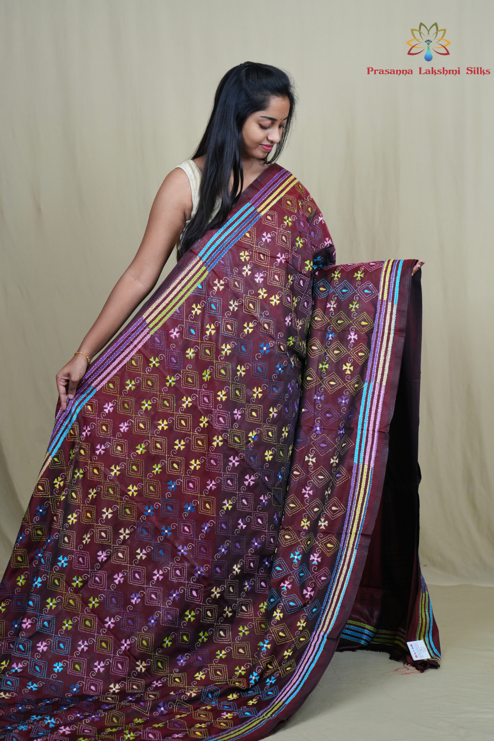 Elegant silk saree featuring Kantha work borders and detailed Kantha pallu design.
