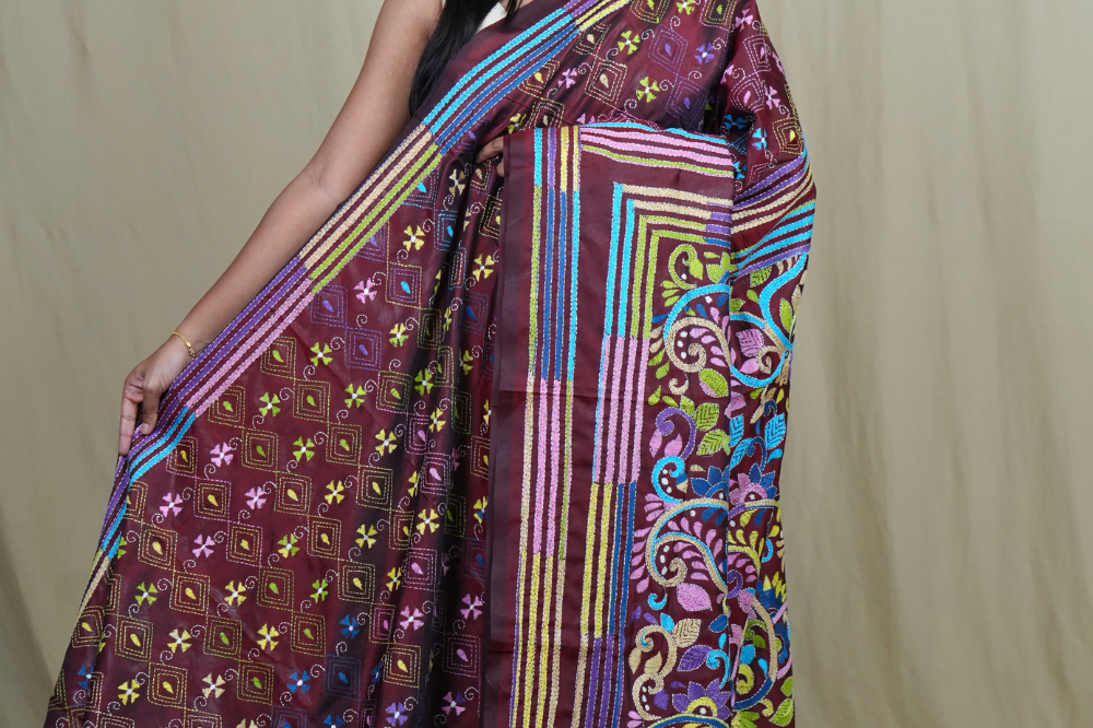 Semi Bangalore silk saree with all-over hand Kantha work and rich embroidered pallu.
