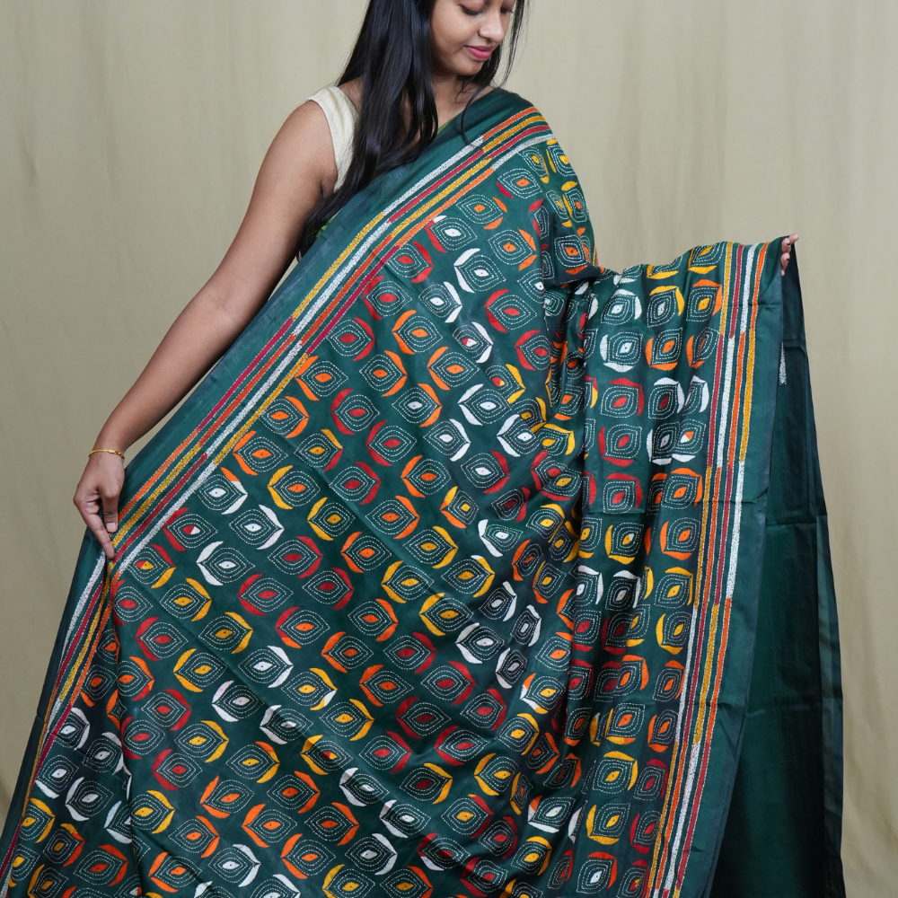 Elegant silk saree featuring Kantha work borders and detailed Kantha pallu design.