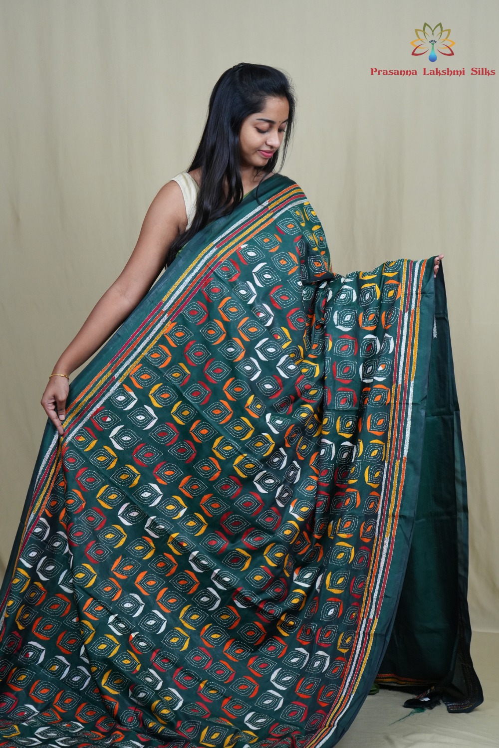 Elegant silk saree featuring Kantha work borders and detailed Kantha pallu design.