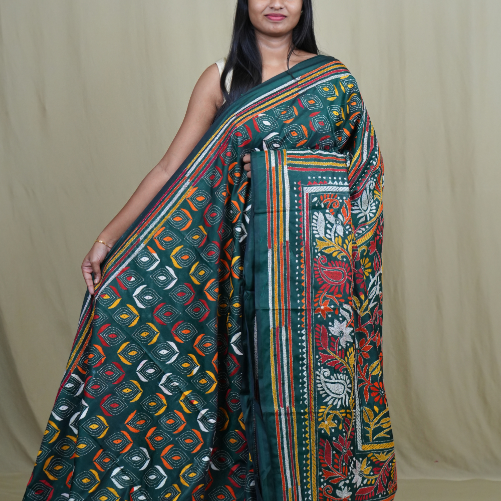 Semi Bangalore silk saree with all-over hand Kantha work and rich embroidered pallu.