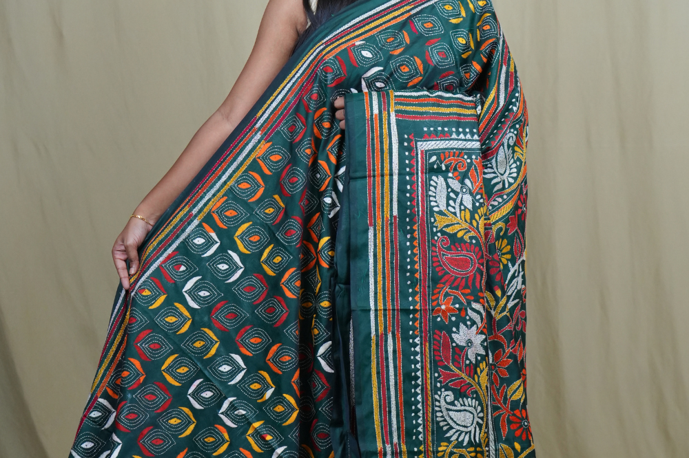 Semi Bangalore silk saree with all-over hand Kantha work and rich embroidered pallu.