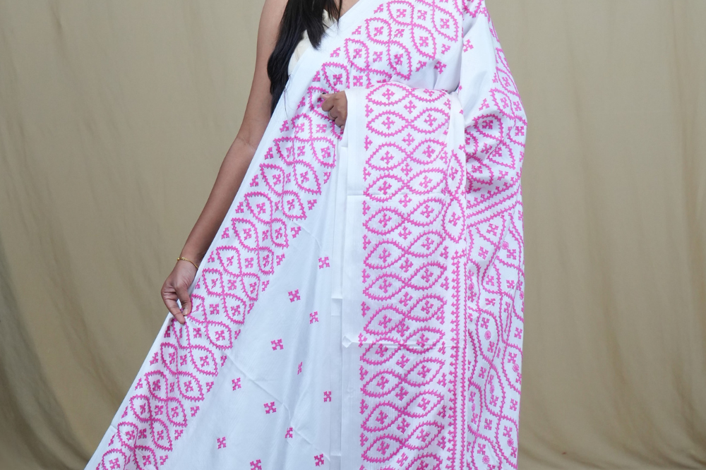 Semi Bangalore Silk Saree with all-over Kutch work motifs and rich embroidered pallu.
