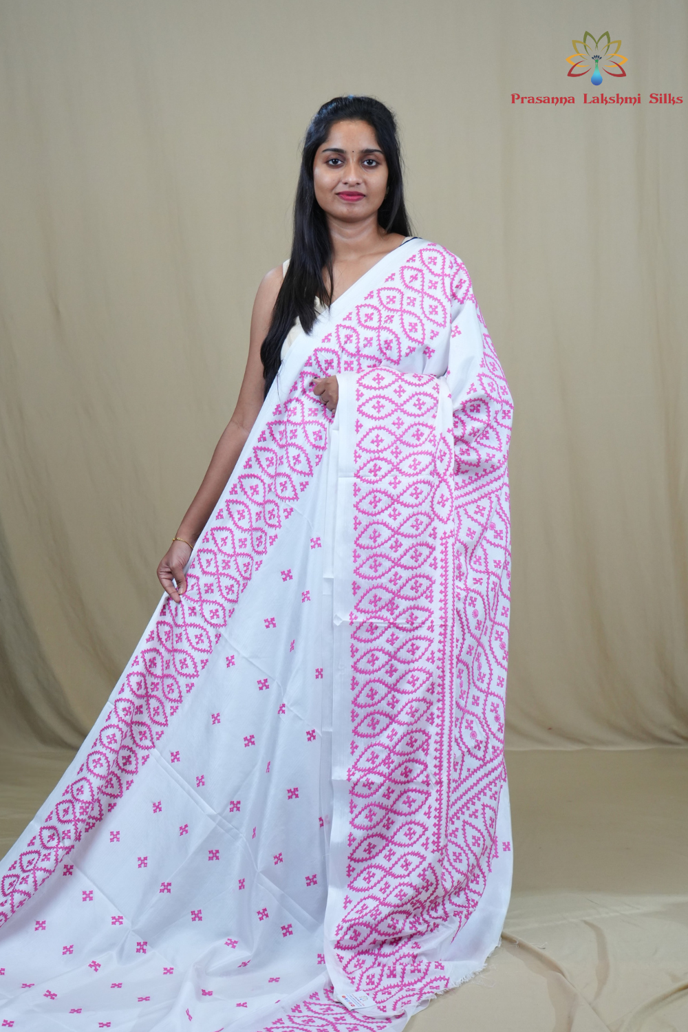 Semi Bangalore Silk Saree with all-over Kutch work motifs and rich embroidered pallu.

