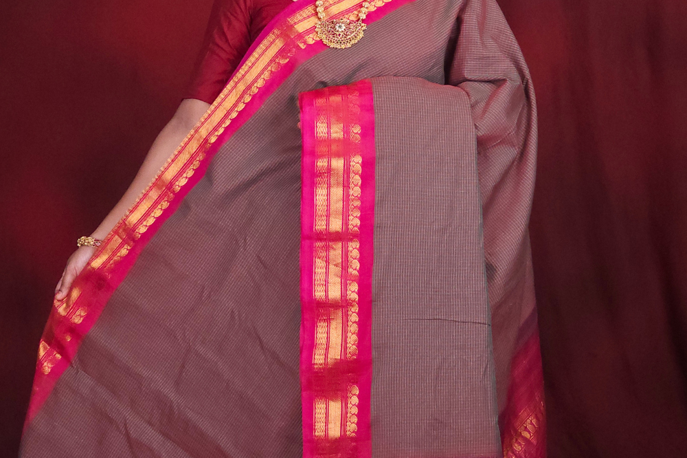 Lightweight Gadwal cotton saree featuring elegant zari border and striped pallu design.
