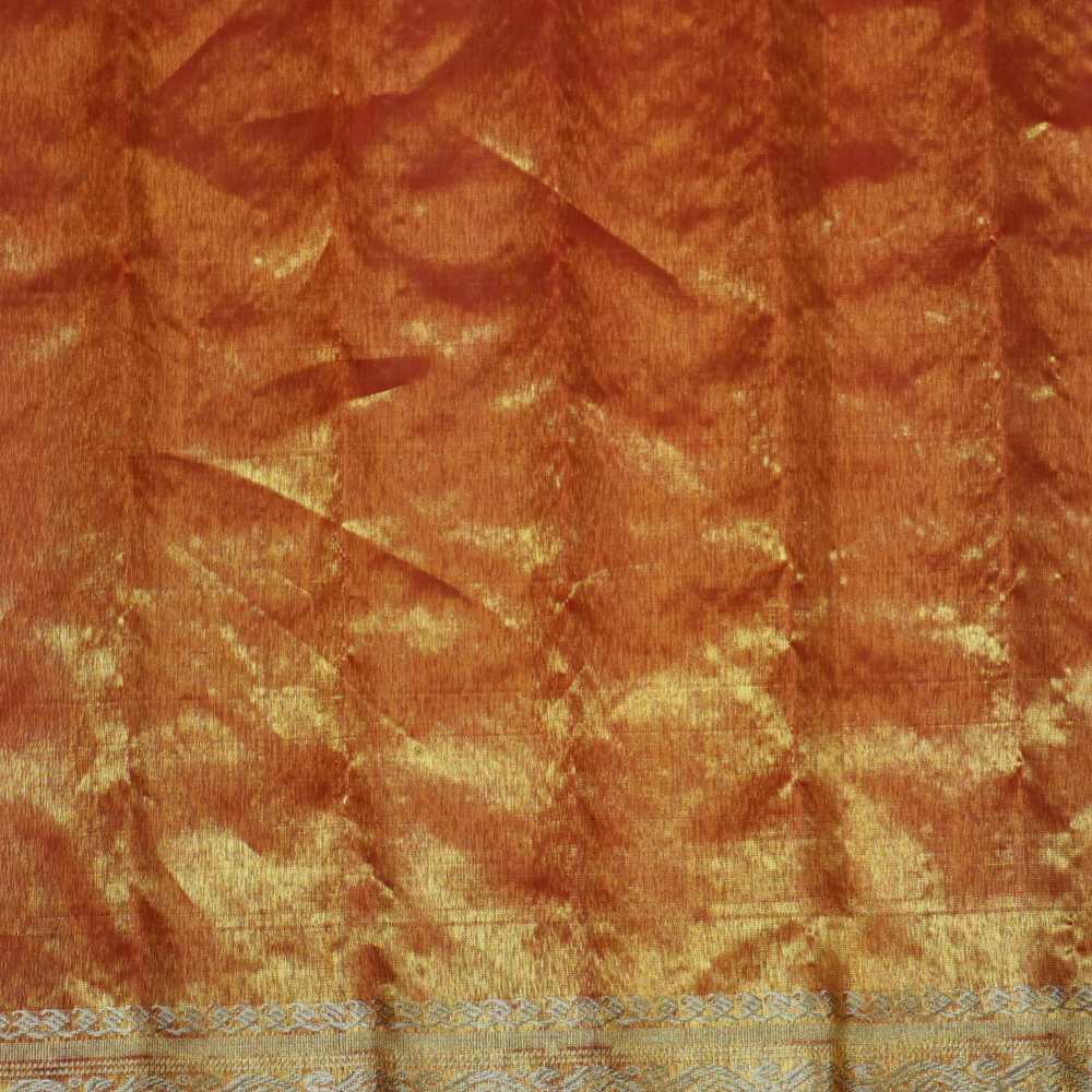 Elegant Gadwal tissue silk saree featuring brocade tissue pallu and contrast blouse.
