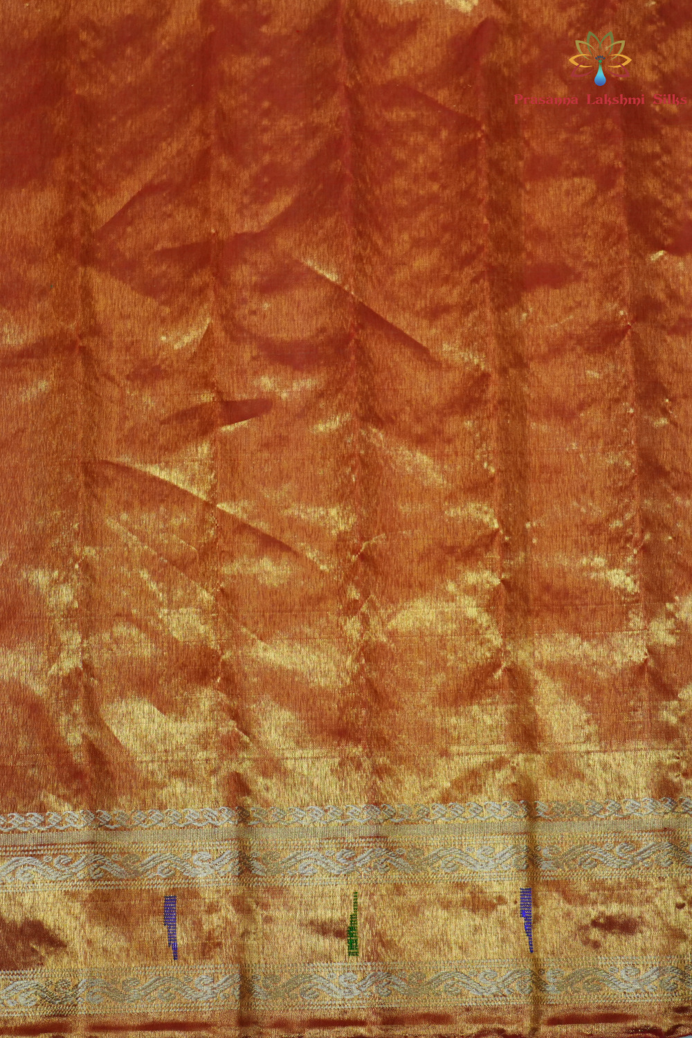 Elegant Gadwal tissue silk saree featuring brocade tissue pallu and contrast blouse.
