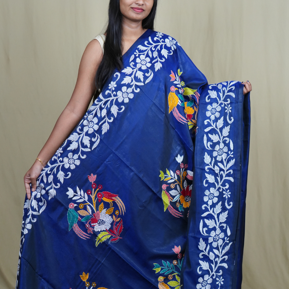 Elegant silk saree featuring Kantha work borders and detailed Kantha pallu design.
