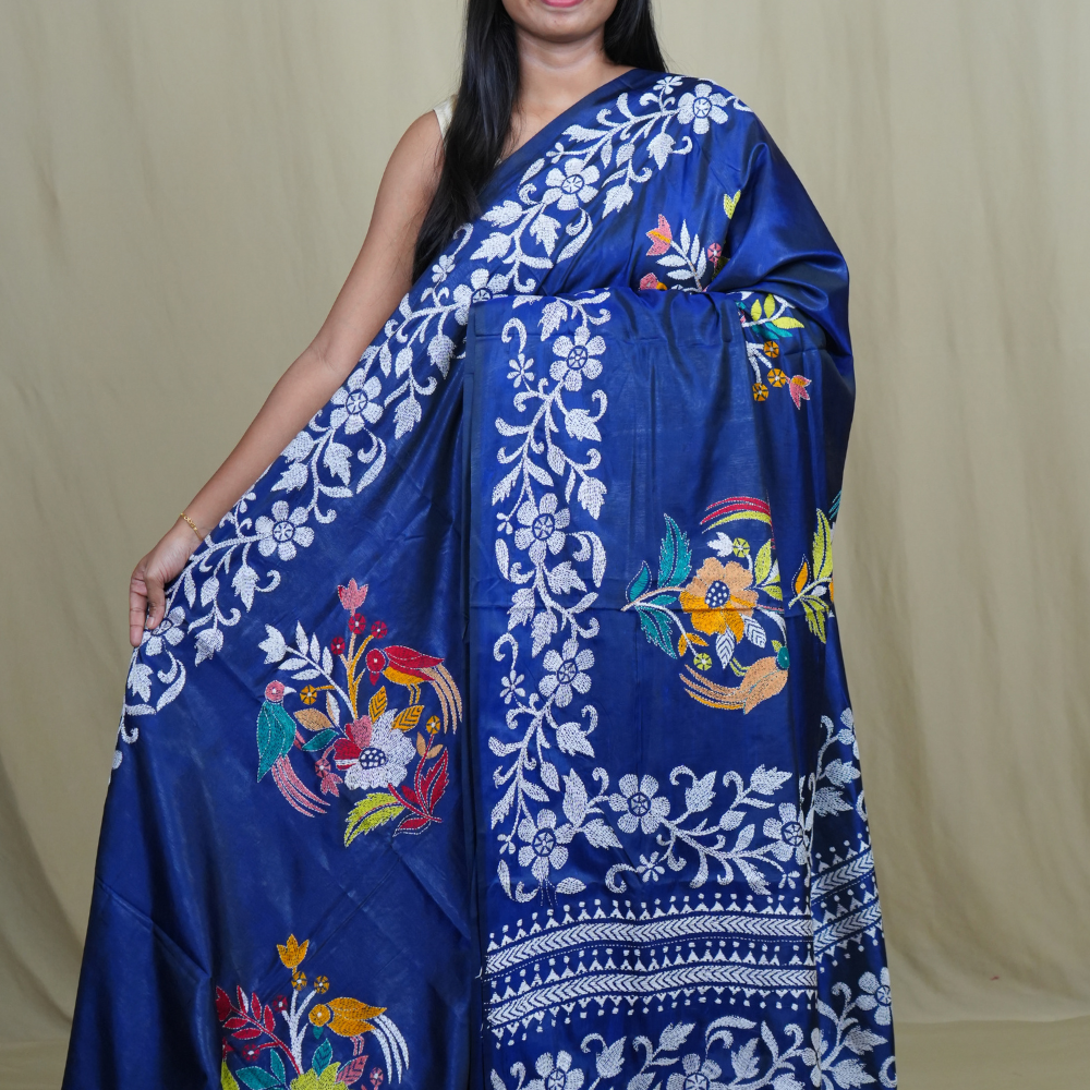 Semi Bangalore silk saree with all-over hand Kantha work and rich embroidered pallu.
