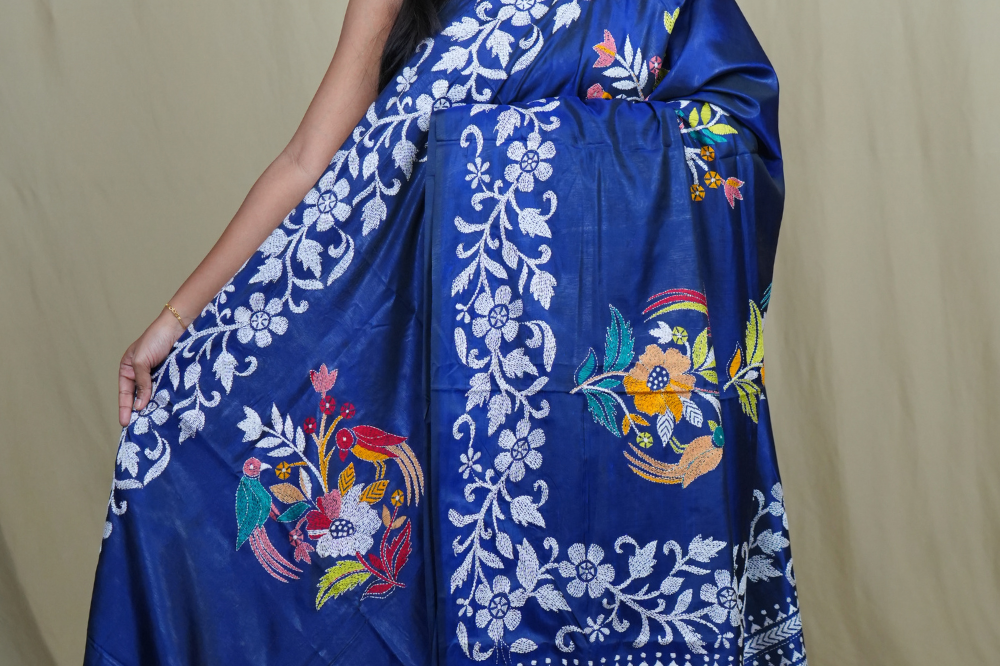 Semi Bangalore silk saree with all-over hand Kantha work and rich embroidered pallu.
