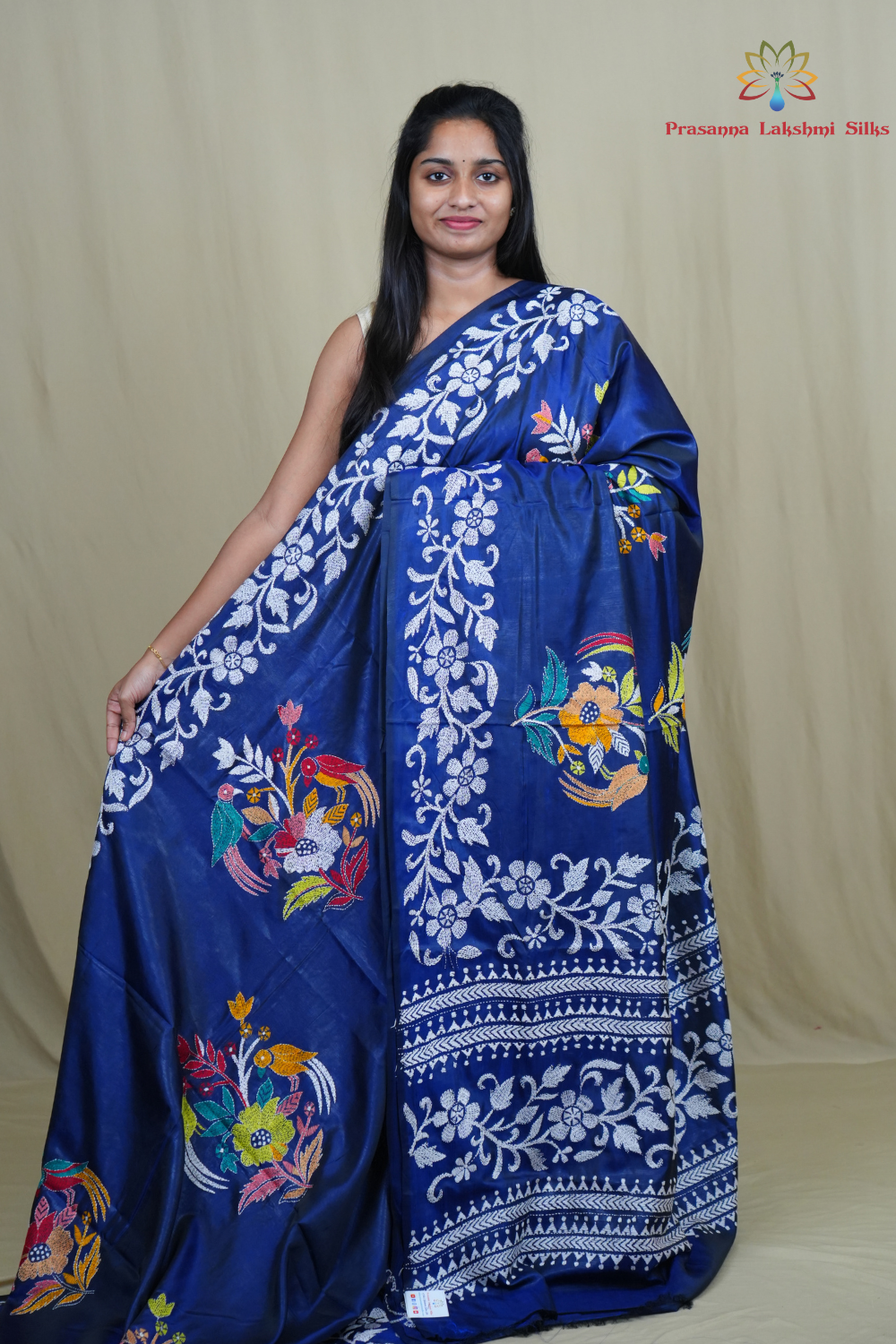 Semi Bangalore silk saree with all-over hand Kantha work and rich embroidered pallu.
