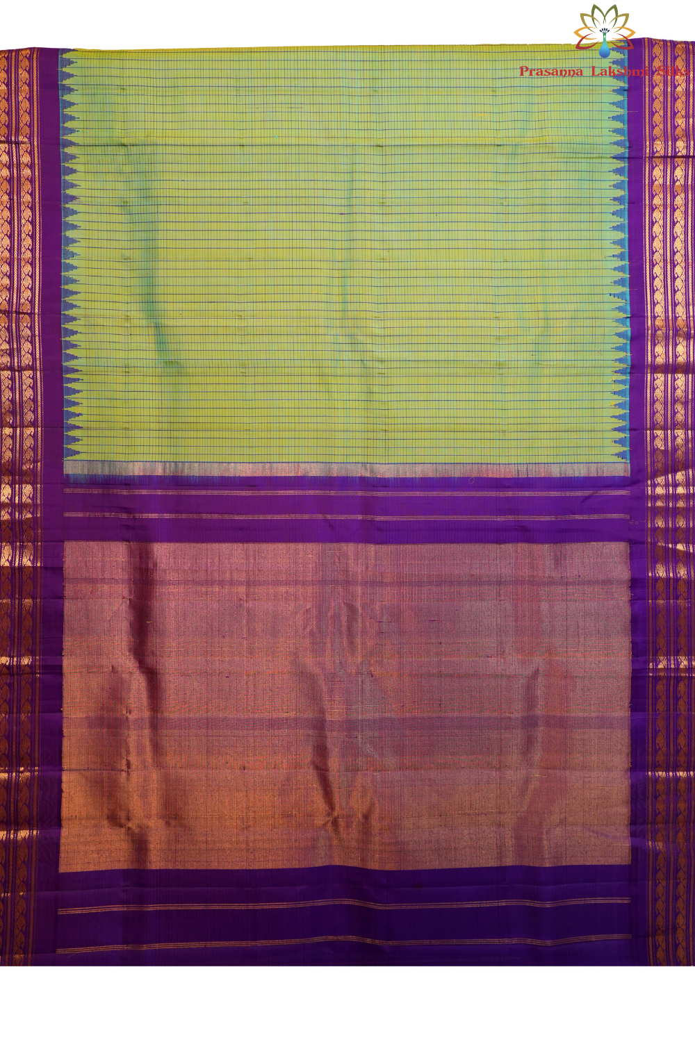 Traditional Gadwal silk saree featuring zari woven temple borders and contrast blouse.
