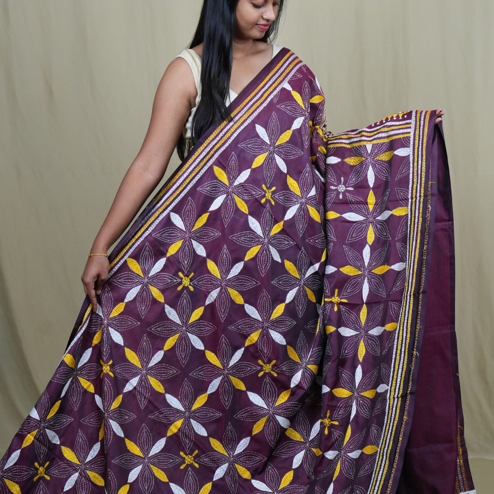 Elegant silk saree featuring Kantha work borders and detailed Kantha pallu design.
